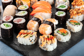 Large sushi set close-up. Various maki, nigiri and rolls