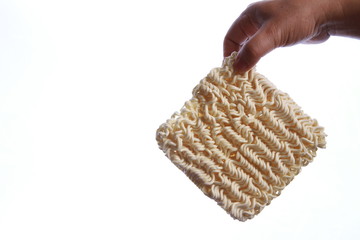 uncooked Instant Noddle in a white bowl