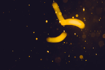 Naklejka premium Dark Abstract Gold bokeh sparkle on black