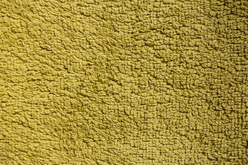Yellow green terry towel textured background close up