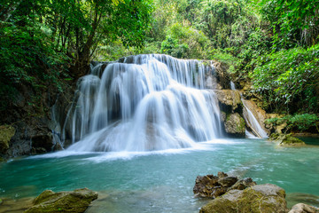 Fototapeta na wymiar Haui Mae Khamin Waterfall is a beautiful waterfall with 7 levels, located in the Srinakarin Dam National Park, Si Sawat District, Kanchanaburi, Thailand.