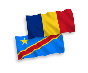 National vector fabric wave flags of Romania and Democratic Republic of the Congo isolated on white background. 1 to 2 proportion.