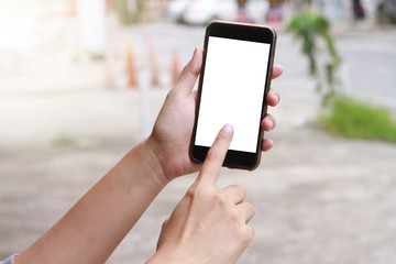 Women holding hands blank smart phone display on a white background. Focus on the hand