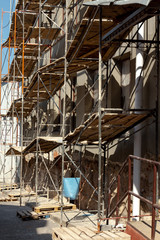 Empty scaffolding near the reconstructed building.