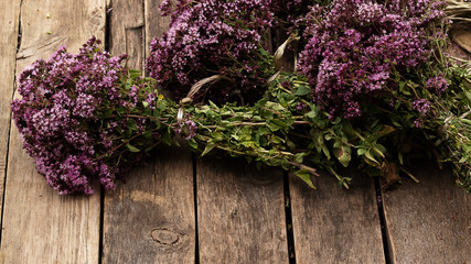 Preparation for drying medicinal herbs - oregano and Hypericum. Alternative medicine is good for your health. Natural nature and rustic style. Purple flowering plants