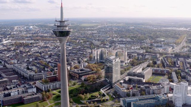 Drone shot of the Rhinetower in Düsseldorf. The video shows the Rhine Tower and the city gate of the Düsseldorf Media Harbour.