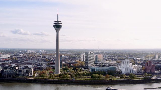 Drone shot of the Rhinetower in Düsseldorf. The video shows the Rhine Tower and the Gehry buildings of the Düsseldorf Media Harbour.