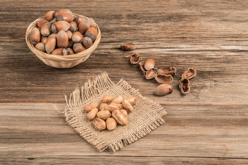 fresh hazelnuts on a wooden table with copy space