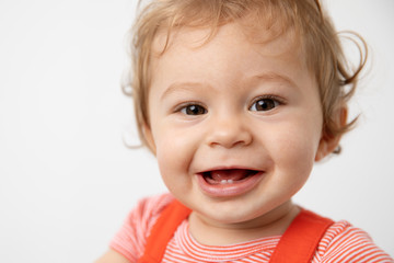 Close up portrait of smiling one year old baby