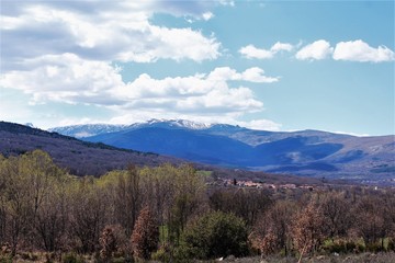 Beautiful landscape of village mountains snow on top in Spain photo
