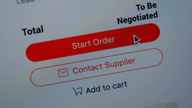 Online shopping. Close up of mouse clicking on Start Order button on Screen