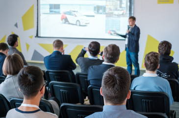 Male speaker doing presentation for business audience