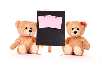 Teddy bear and post-it notes with blackboard on a white background Valentine concepts and love.