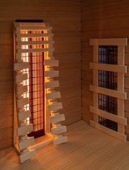 Interior view of a private infrared sauna with heaters and variable backrest