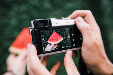 Taking a photo of a watermelon slice