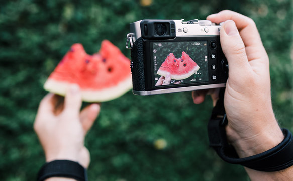 Taking a photo of a watermelon slice