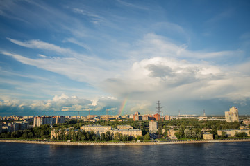 View of the distant city and the rainbow above it