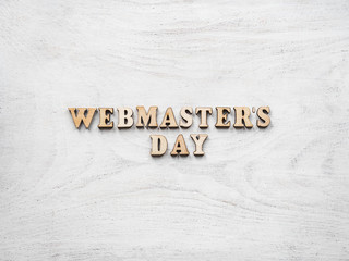 Webmaster Day greeting card. Isolated background, close-up, view from above, wooden surface....