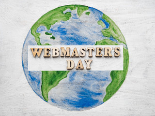 Webmaster Day greeting card. Isolated background, close-up, view from above, wooden surface....