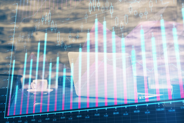 Forex market graph hologram and personal computer on background. Multi exposure. Concept of investment.