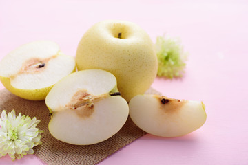 Fresh Asian pear fruit on pink background