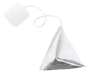 Tea bag with white label isolated on white background.
