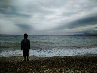 Boy looking to the horizon / the future