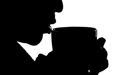 black silhouette of a girl on a white background who is drinking a hot drink from a mug