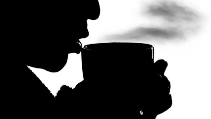 black silhouette of a girl on a white background who is drinking a hot drink from a mug