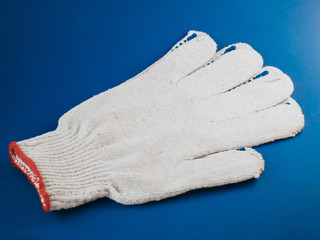 white construction gloves on a blue background.