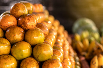 A pile of oranges arranged for sale in the market.