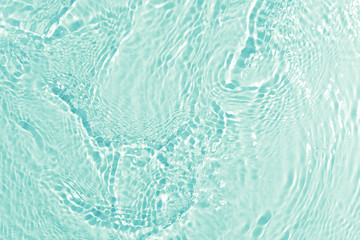 texture of splashing clean water on turquoise background