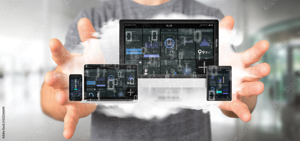Poster businessman holding devices connected to a cloud multimedia network 3d rendering