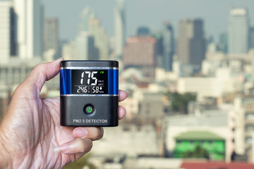 PM 2.5 Detector over smog city from PM2.5 dust. Air pollution, Love health concept.