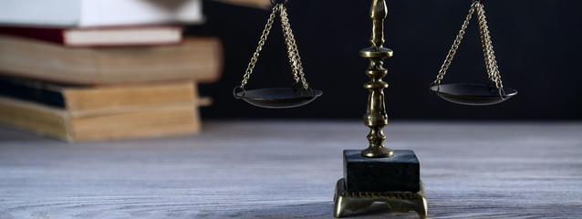 Law and Justice symbols over black background