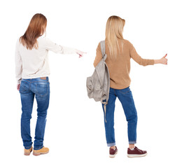 Back view of two pointing young girl in sweater.