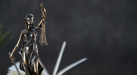 Law and Justice symbols over black background