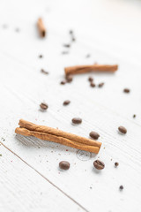 spices on a white wooden background. cinnamon and star anise on a white background