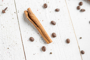 spices on a white wooden background. cinnamon and star anise on a white background