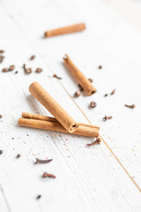 spices on a white wooden background. cinnamon and star anise on a white background