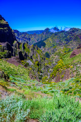 Beautiful hiking trail from Pico do Arieiro to Pico Ruivo, Madeira island. Footpath PR1 - Vereda do Areeiro. On summy summer day above the clouds. Portugal.