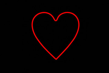 Valentine day.  Red heart in one neon sign on isolated black background. Neon concept. Modern style. Neon sign.