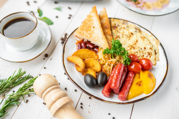 delicious breakfast. coffee, crepes and porridge for breakfast. breakfast on a white background