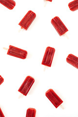 Red ice-cream pattern on white background. Flat lay, top view.