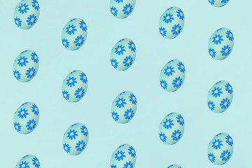 Blue Easter eggs on a blue background. Festive preparation, pattern, repetition, banner.