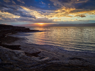 Beautiful sunset at Dead Sea, Jordan. Salt beach
