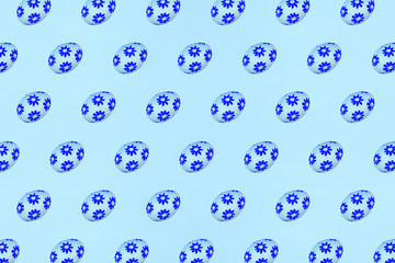 Blue Easter eggs on a blue background. Festive preparation, pattern, repetition, banner.