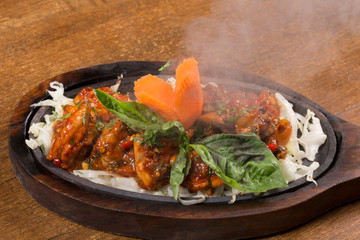 Chili Chicken served on a hot plate