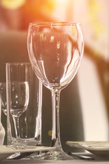 Empty wine glass on the table in a cafe or restaurant. Selective focus
