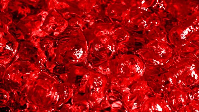 Boiling Scarlet Liquid. Intense drilling. Visual imitation of boiling blood. Slow motion boiling water, painted blood red